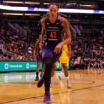 Caitlin Clark Hits Suspension Line After Controversial Foul Brittney Griner driving to the basket during a basketball game