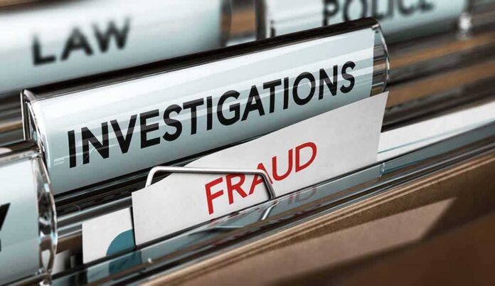 File folders labeled investigations and fraud in a filing cabinet