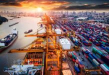 Warnings Came Before the Kuwait Strike Container port with cranes and cargo ships at sunset