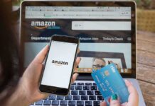 Amazon Blocks AI From Shopping Person shopping on Amazon with phone and credit card