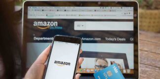 Person shopping on Amazon with phone and credit card