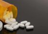 40 Pills At Once: Nine Years Addicted to Codeine Prescription bottle with white tablets spilling out