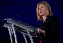 Powerhouse Senator Suddenly On The Ropes Marsha Blackburn speaking at a podium with a microphone