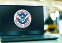 DOJ Confirms Omar Home Search Remains Ongoing Laptop displaying U.S. Department of Homeland Security logo.