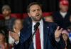Activist Pressure Shapes Texas Democratic Debate Man in suit speaking at a podium