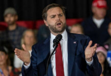 Activist Pressure Shapes Texas Democratic Debate Man in suit speaking at a podium
