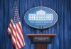 Trump Draws Nuclear Policy Contrast White House press briefing podium and US flag