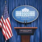 Trump Draws Nuclear Policy Contrast White House press briefing podium and US flag