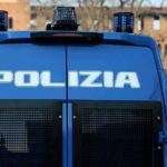 Police Use Water Cannons on Turin Students Italian police van rear with blue lights and grilles