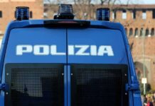 Police Use Water Cannons on Turin Students Italian police van rear with blue lights and grilles