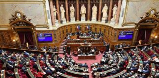 Parliament chamber with lawmakers seated in semicircular rows