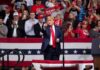 Y.M.C.A. Finale Sparks San Antonio Uproar Donald Trump points from a rally stage; Rudi Koertzen and Bear Pascoe are in the crowd