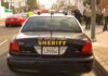 Armed Robbers Attack Actor in California Sheriff patrol car parked on city street