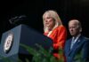 Trump Fills Two-Month Press Secretary Vacancy Jill Biden speaks at a podium as Joe Biden stands behind her