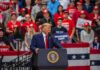 Cleveland to Get New Submarine Repair Center Donald Trump speaks at a rally podium; Christian Jones and Bear Pascoe are in the crowd behind him