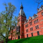 Historic red brick building with tower on a sunny day