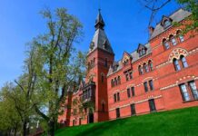 Two Years Later, Case Faces New Scrutiny Historic red brick building with tower on a sunny day