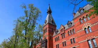Historic red brick building with tower on a sunny day