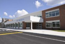Judge Finds Possible First Amendment Violations Modern school building with large windows and a clear sky