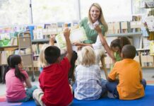 Pastor Found Guilty After Disrupting Children’s Library Event Teacher reading to children in a library circle